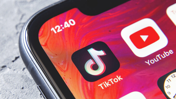 TikTok and YouTube apps on screen iphone xr, close up