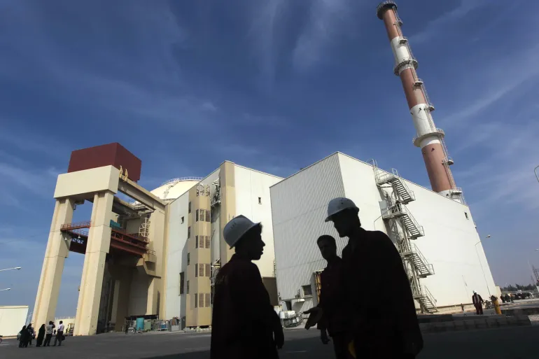 Workers stand in front of the Bushehr nuclear power plant, 1,200km (750 miles) south of Tehran Reuters