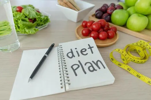 a-dining-table-with-fruits-vegetables-and-a-diet-plan-free-photo
